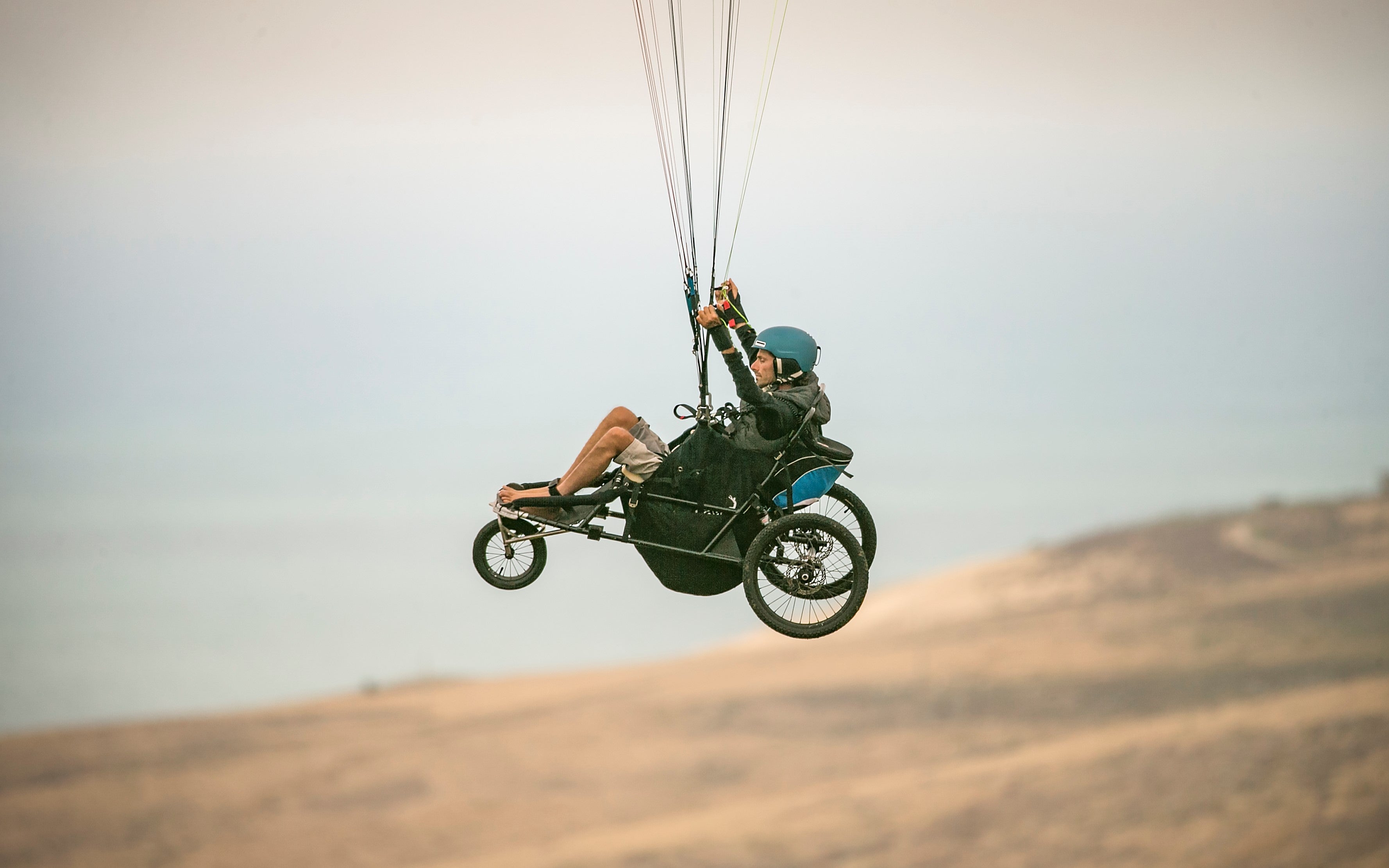 Jezza Williams who has Tetraplegia or quadriplegia is paragliding solo while seated in a buggy with 
