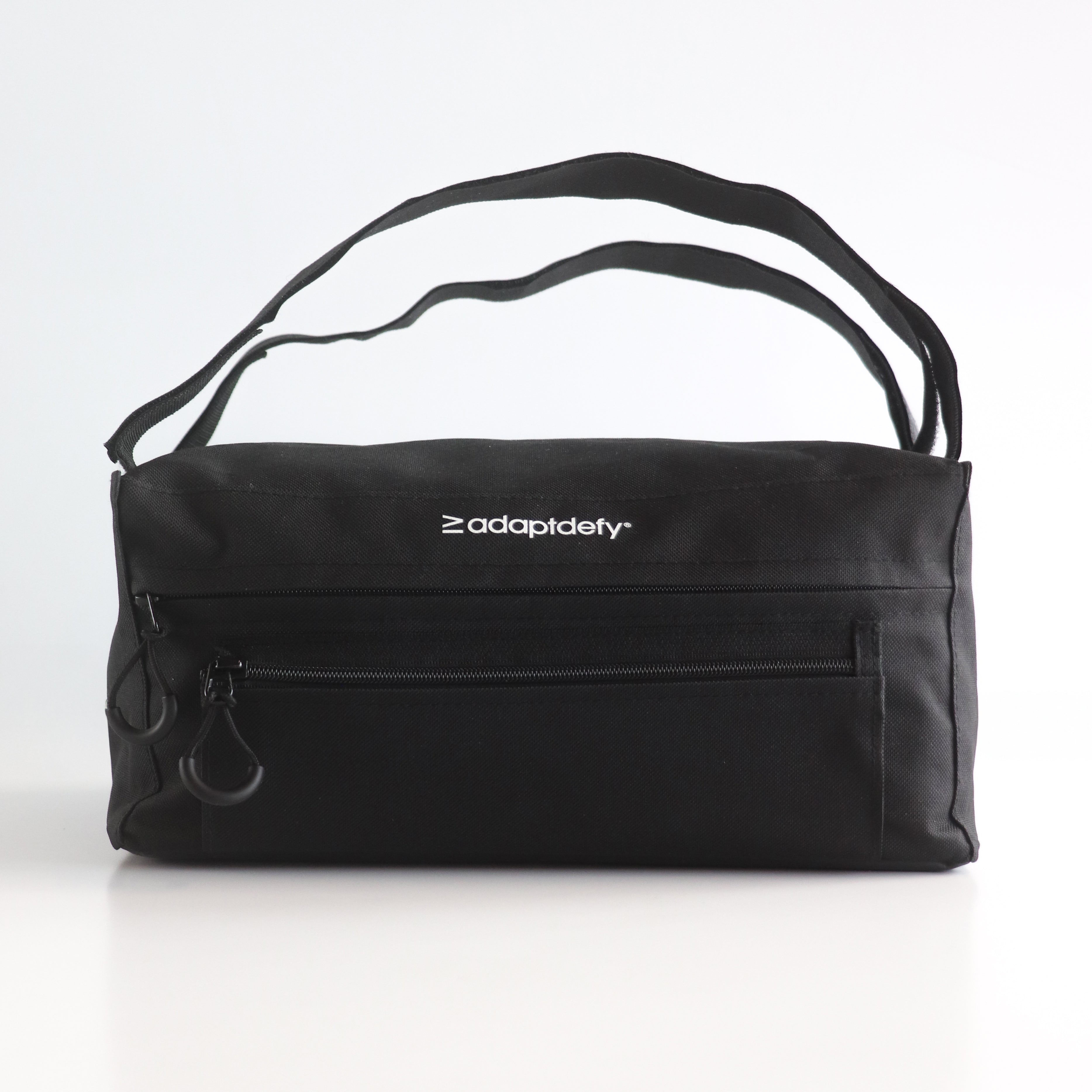 Large Black bag for wheelchairs with 'adaptdefy' logo on a white background. Details show the large 10L main pocket and smaller front pocket