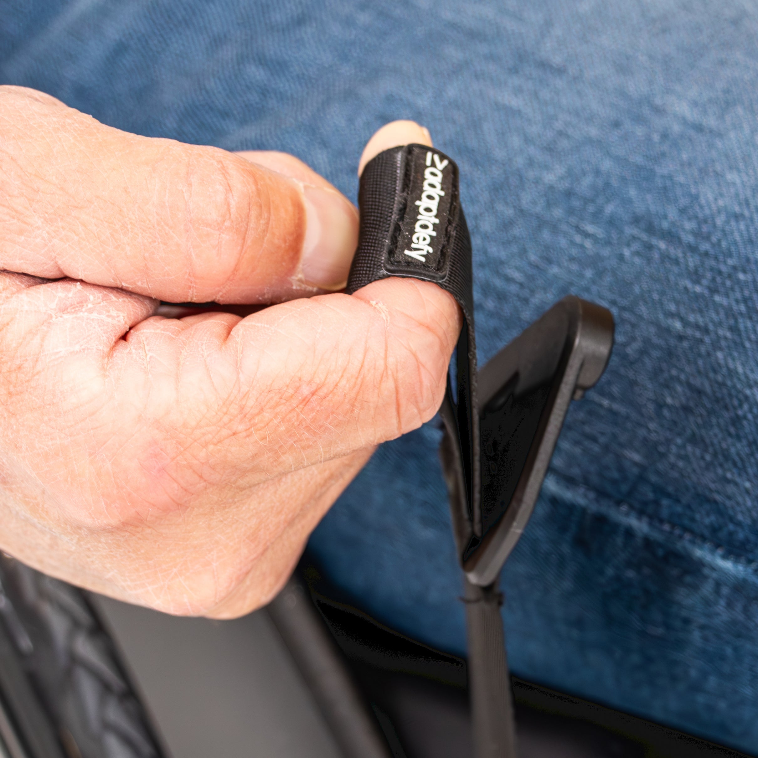 Closeup of finger in loop of LapStacker