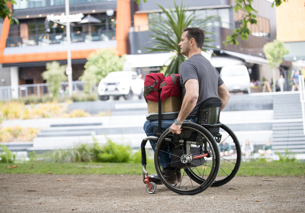 Wheelchair pushing technique and chair setup for healthy shoulders.