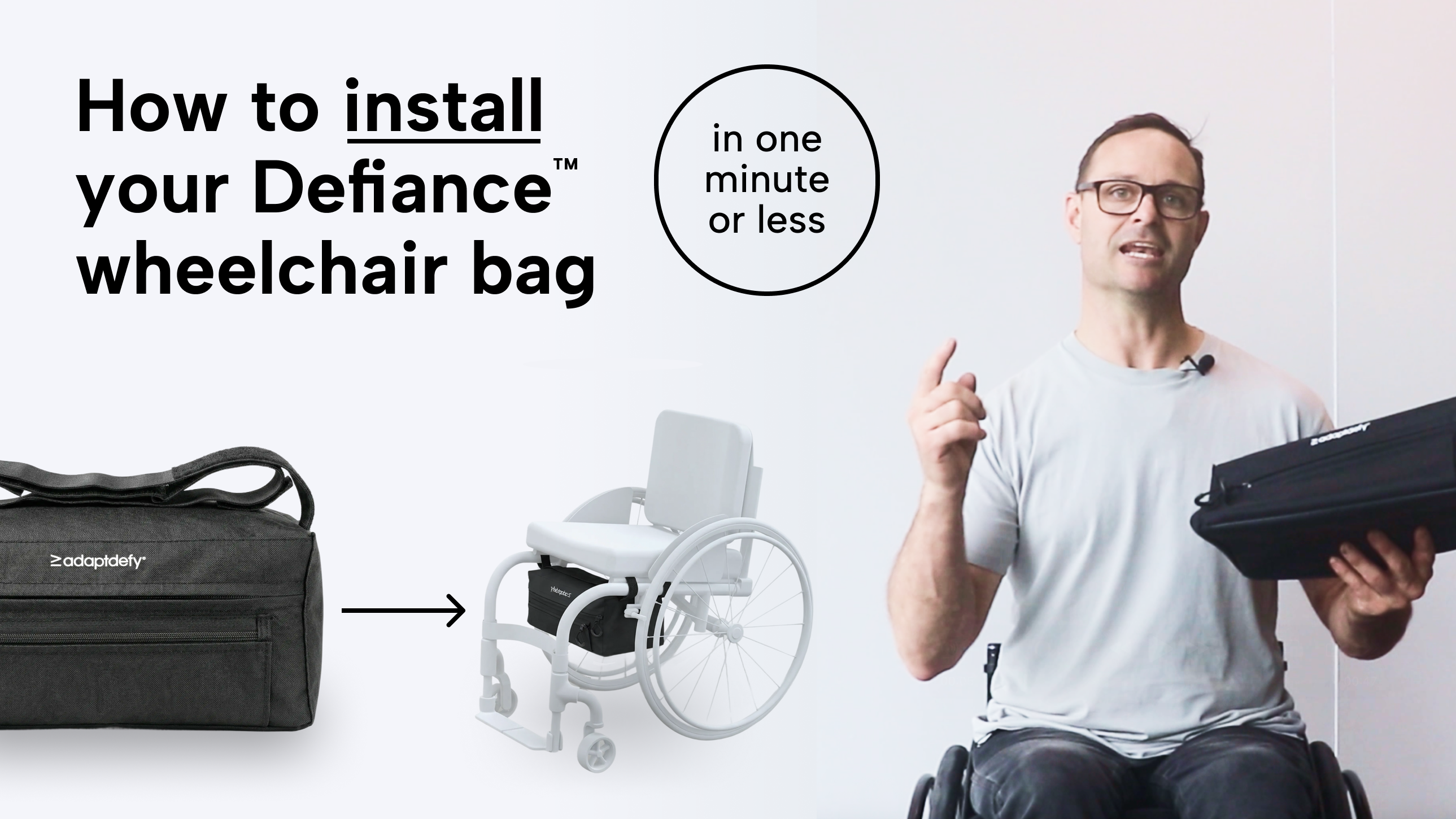 YouTube video thumbnail showing AdaptDefy founder Mike Brown in a manual wheelchair demonstrating how to install the Defiance™ underseat wheelchair bag in one minute or less. Bag installs via straps., makes it quick and easy. 
