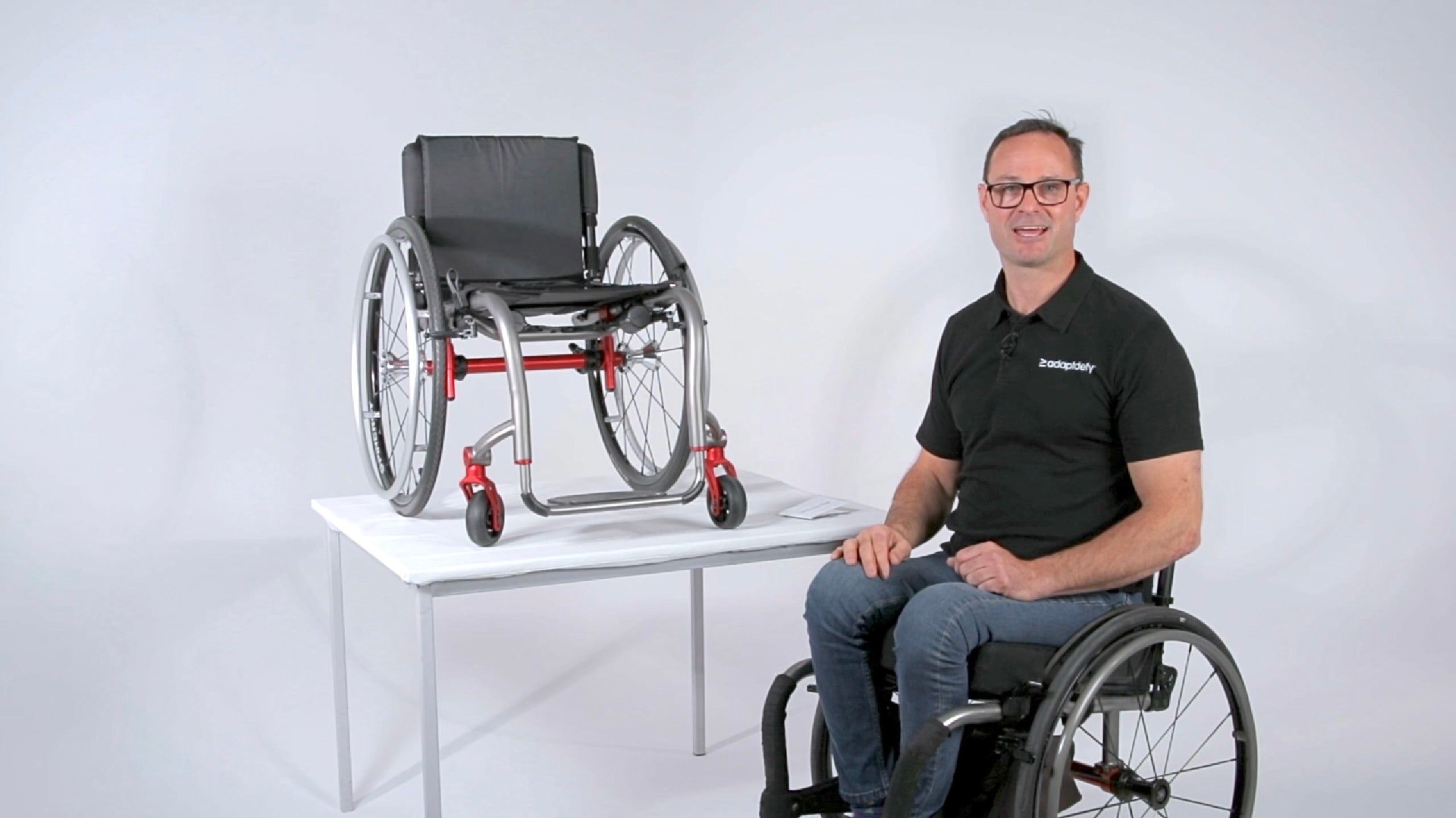 A man in a wheelchair shares some important safety and care instructions for LapStacker, including warnings and limitations.