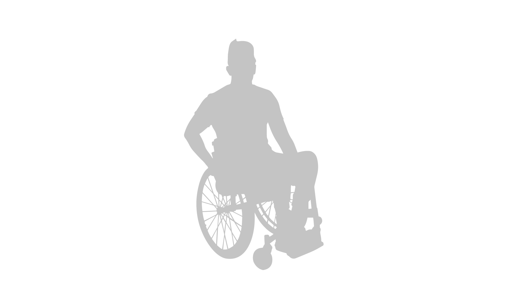 Shadowed nondescript image of a man seating in a manual wheelchair