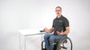 In this video a man in a wheelchair shows how to install the LapStacker Flex Top Buckle Holder.