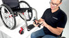 In this video a man in a wheelchair explains and shows how to install a LapStacker Flex horizontally around the seat base of a manual rigid wheelchair.