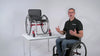 In this video, a man in a wheelchair shares some important safety and care instructions for LapStacker, including warnings and limitations.